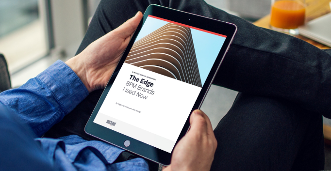 Image of someone looking at a tablet with the ebook 'The Edge BPM Brands Need Now' displayed.