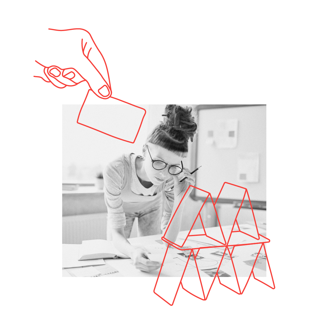 Woman building a house of cards