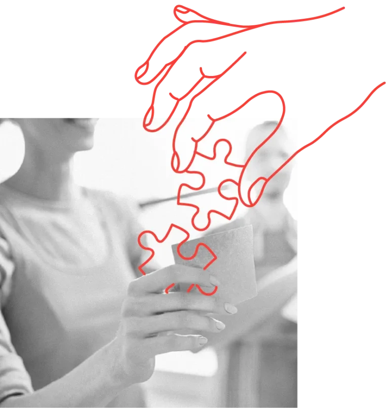 two hands connecting puzzle pieces