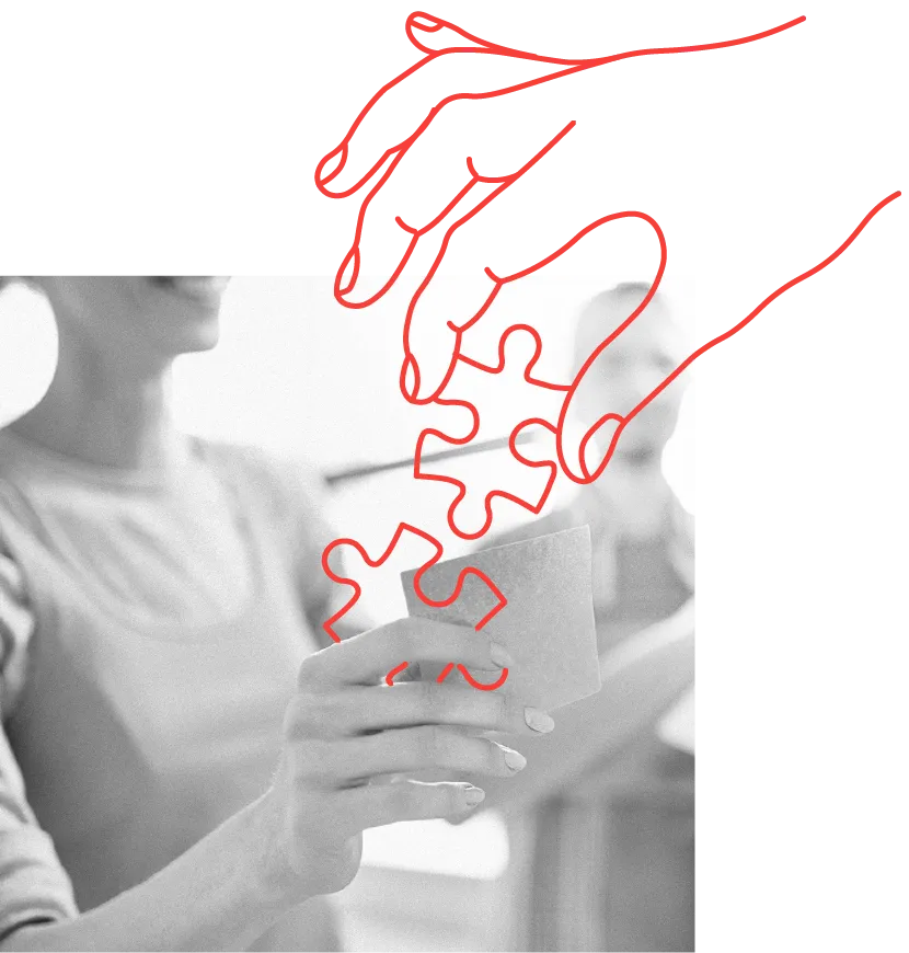 two hands connecting puzzle pieces